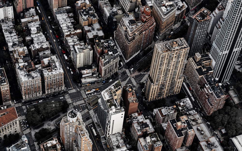 an aerial view of a city with tall buildings