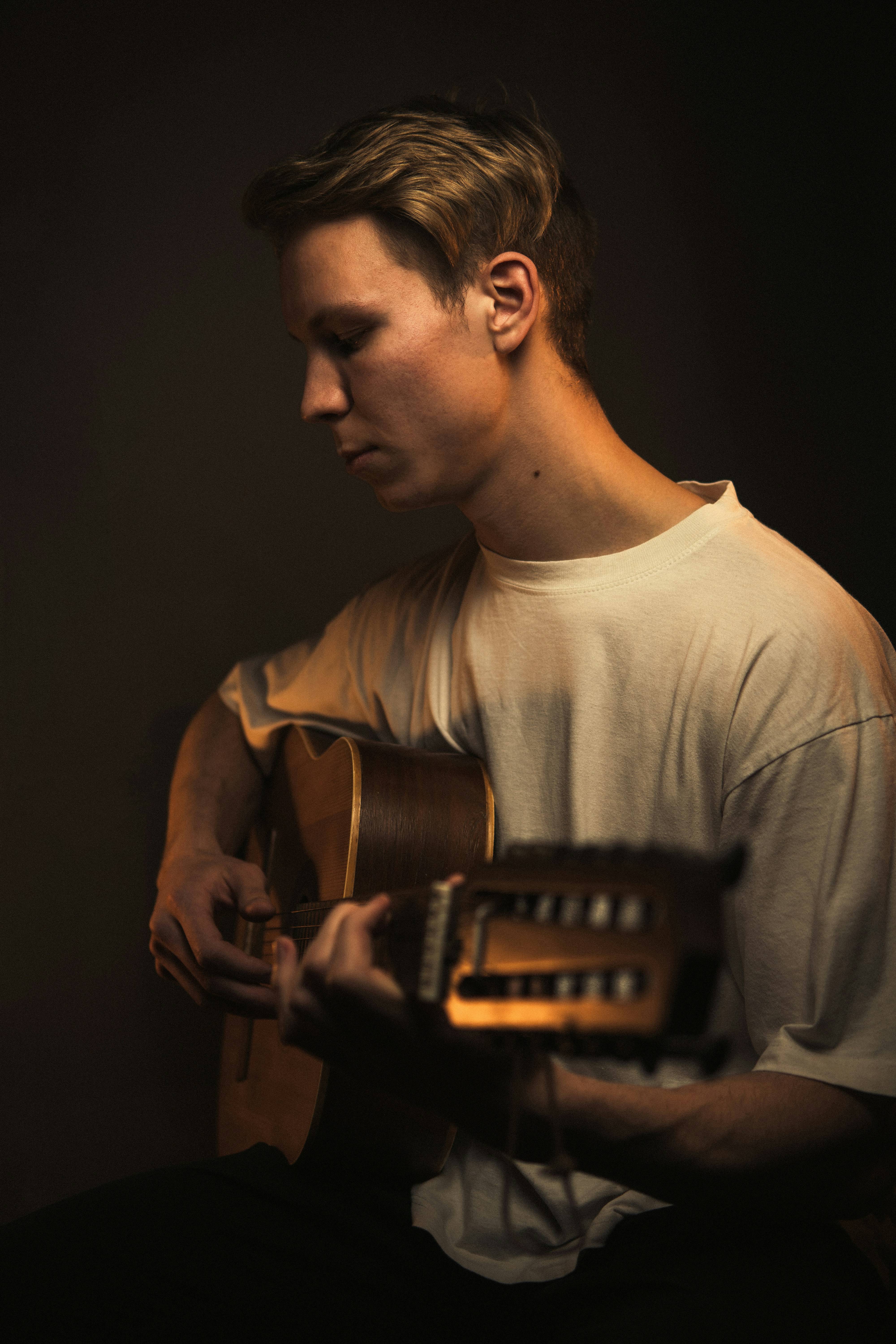 a man with a guitar in his hands