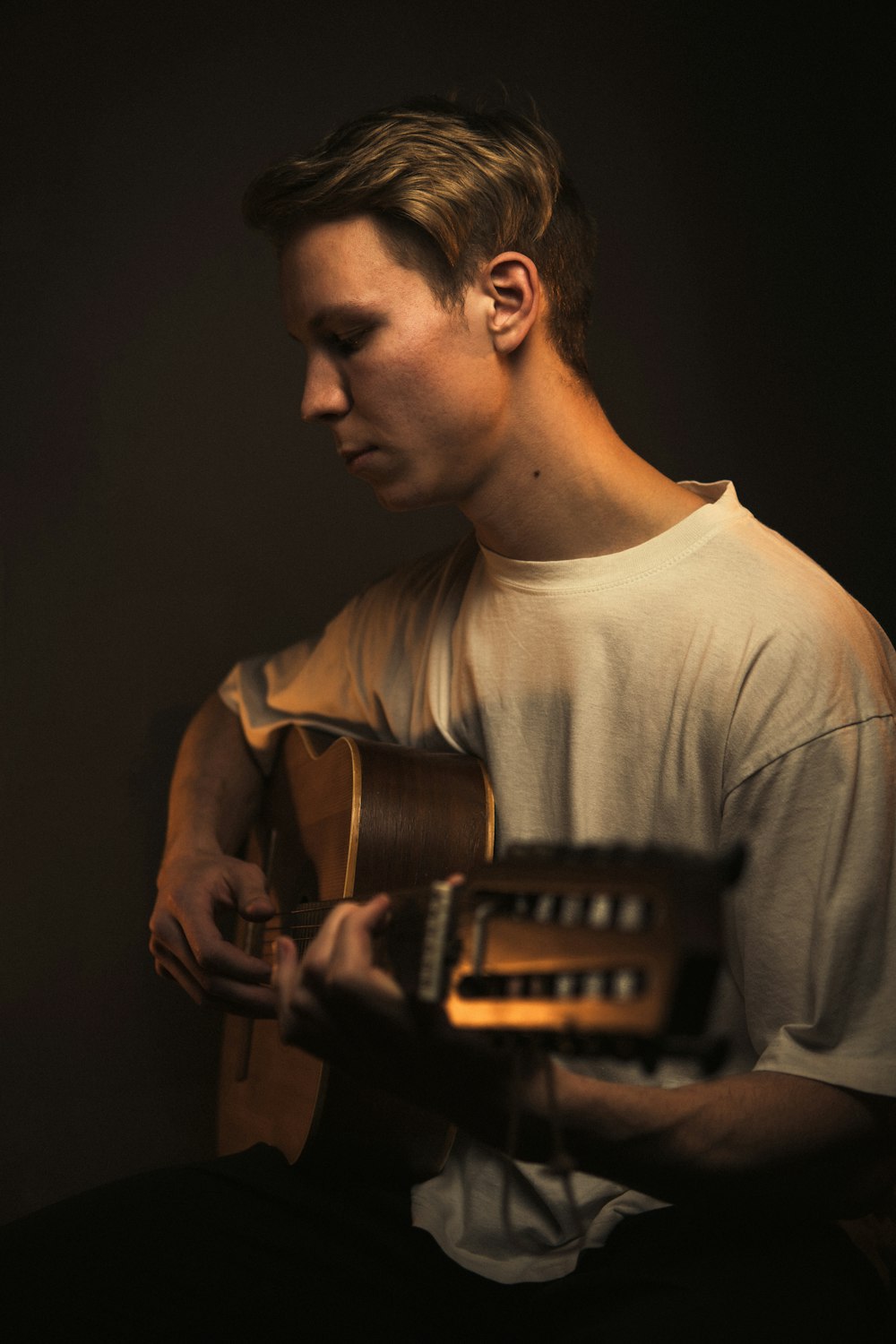 a man with a guitar in his hands