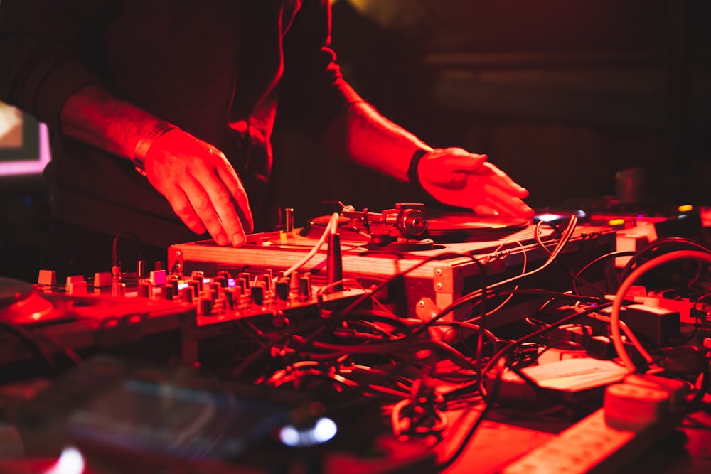 a dj mixing music in a dark room