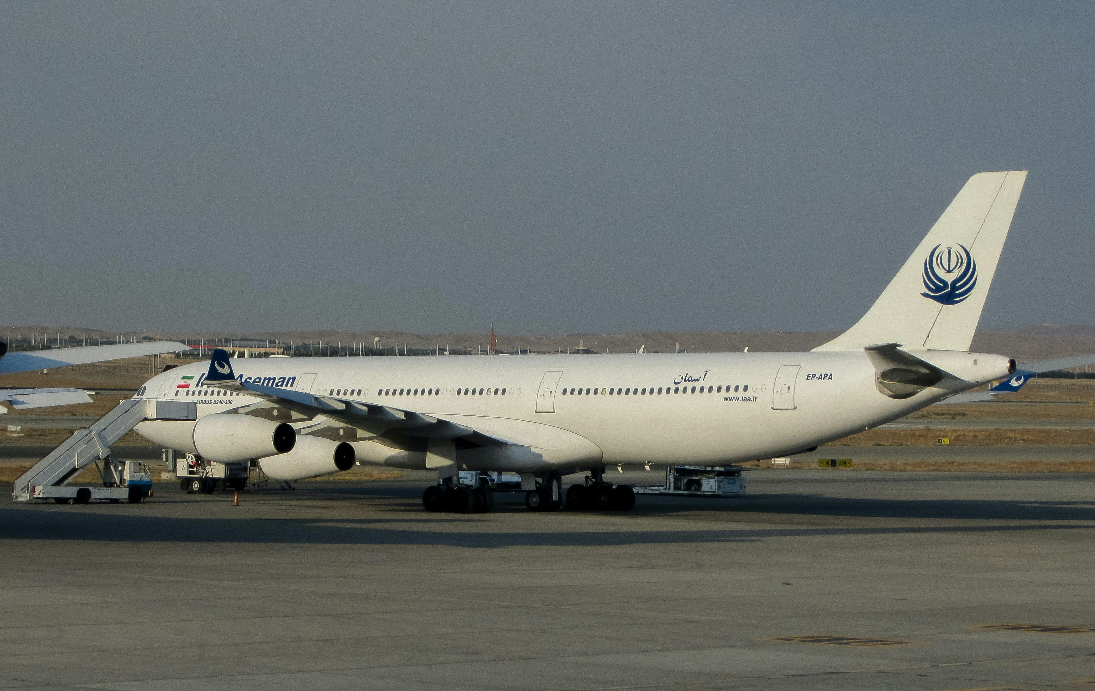 a large jetliner sitting on top of an airport tarmac, Airbus a340 300 IRAN ASEMAN