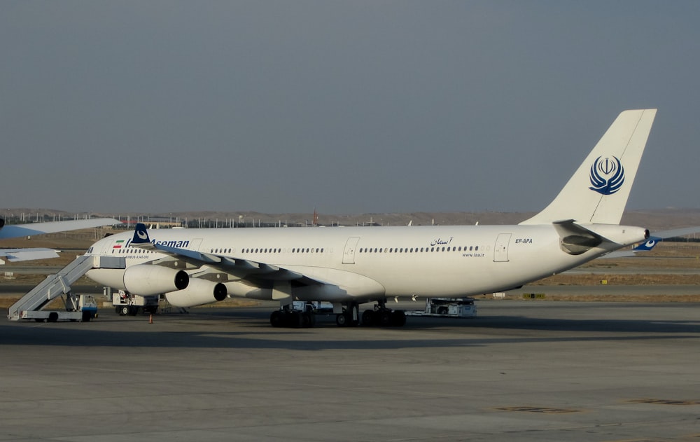 a large jetliner sitting on top of an airport tarmac