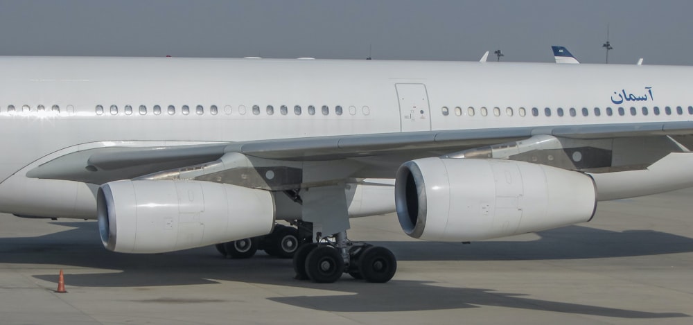 a large jetliner sitting on top of an airport tarmac