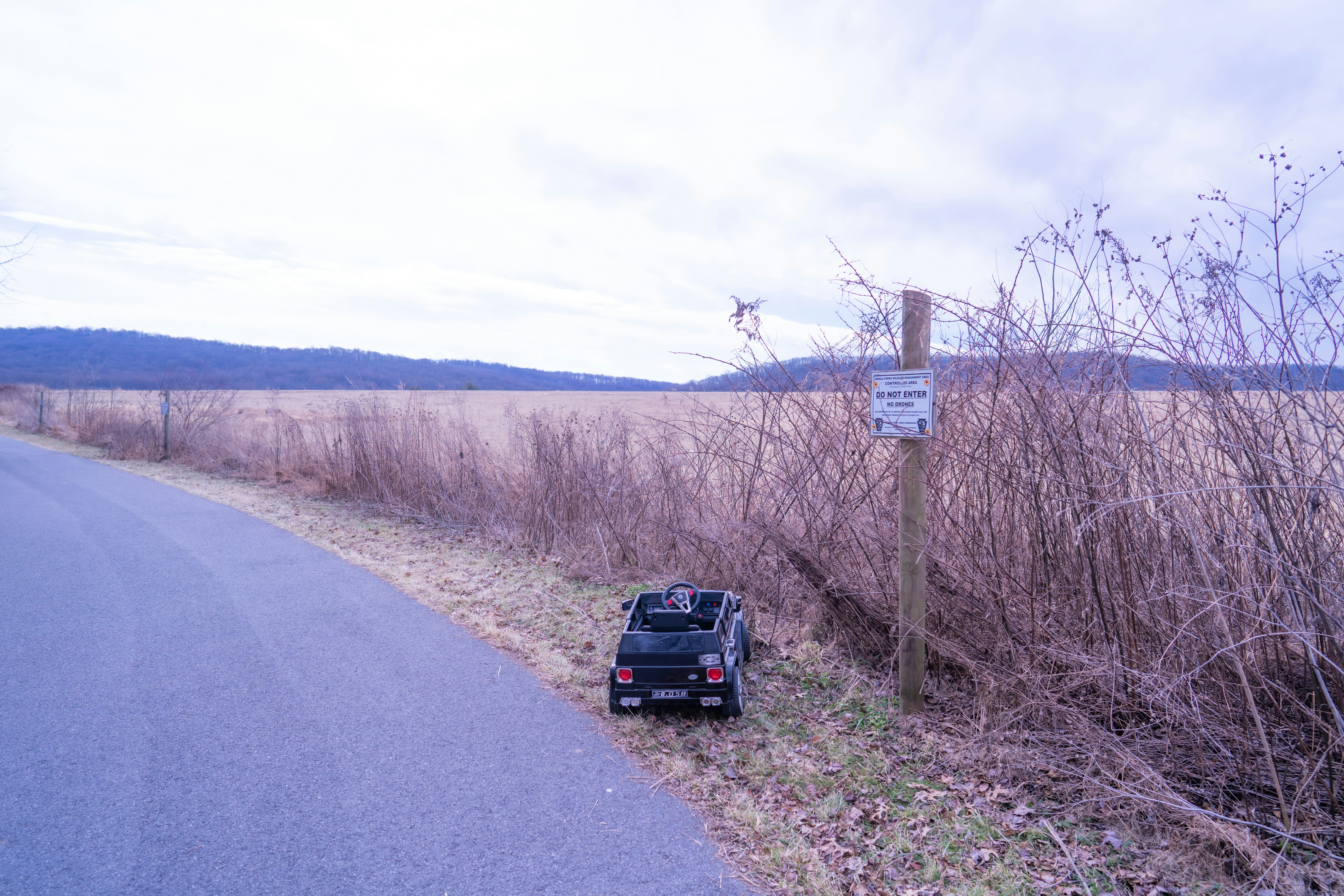 a car is parked on the side of the road