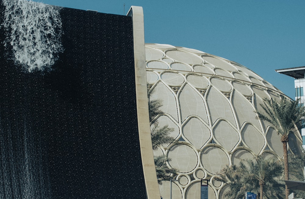 a large white building with a black and white design on the side of it