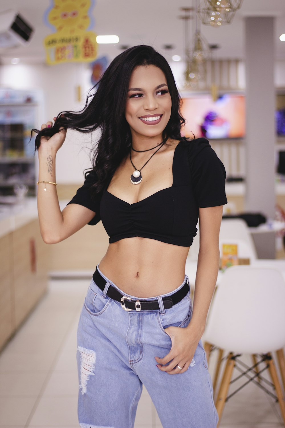 a woman posing for a picture in a store