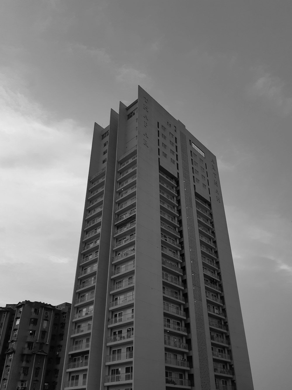 a black and white photo of a tall building