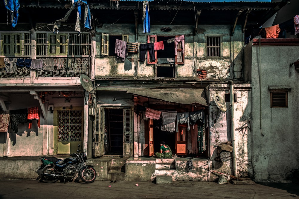 a motorcycle parked in front of an old building