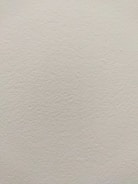 Picture of a smooth plaster wall finish with subtle texture.