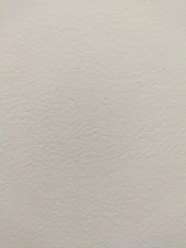 Freshly painted interior wall highlighting smooth and even finish.