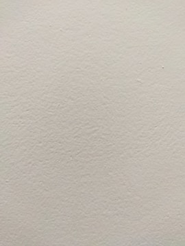 Freshly painted interior walls with smooth finish.