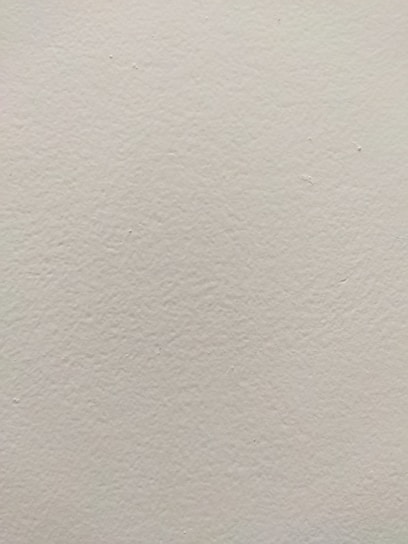A beautifully finished drywall with a smooth texture.
