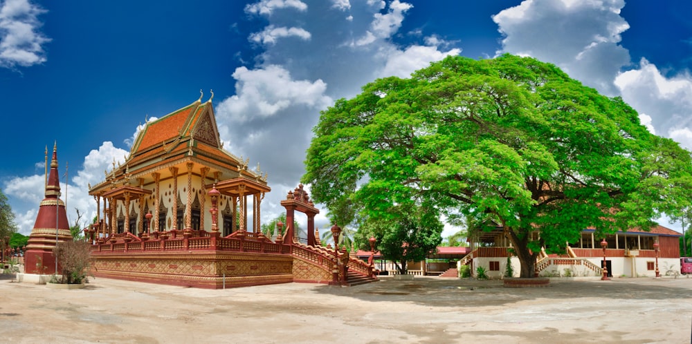 a large building with a tree in front of it