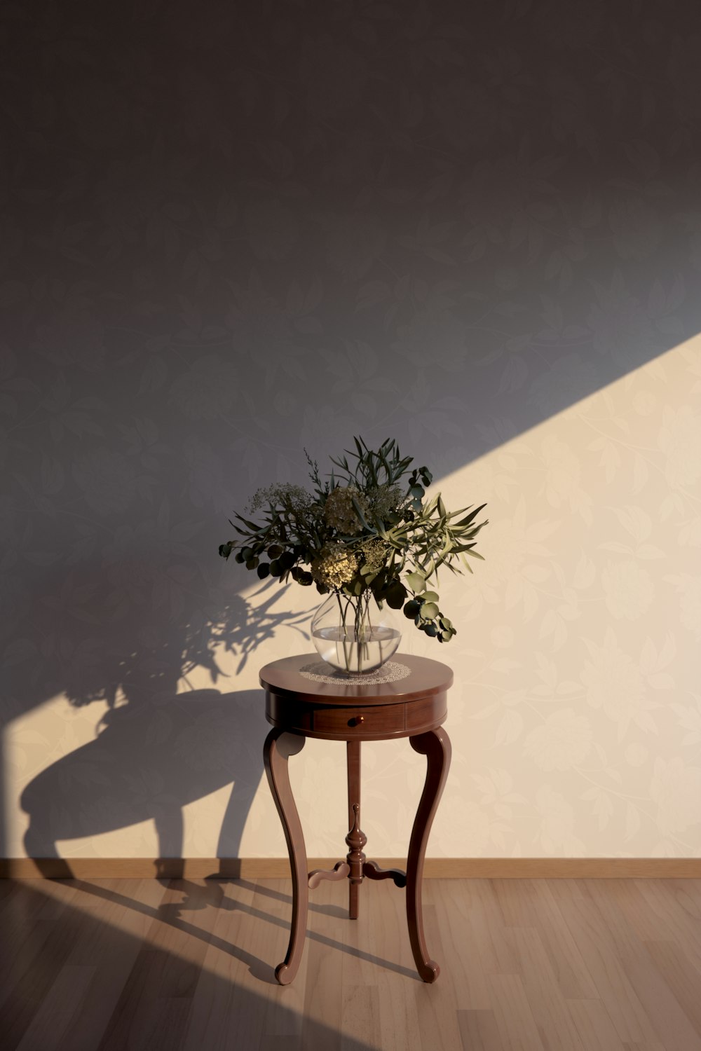 a small table with a vase of flowers on it