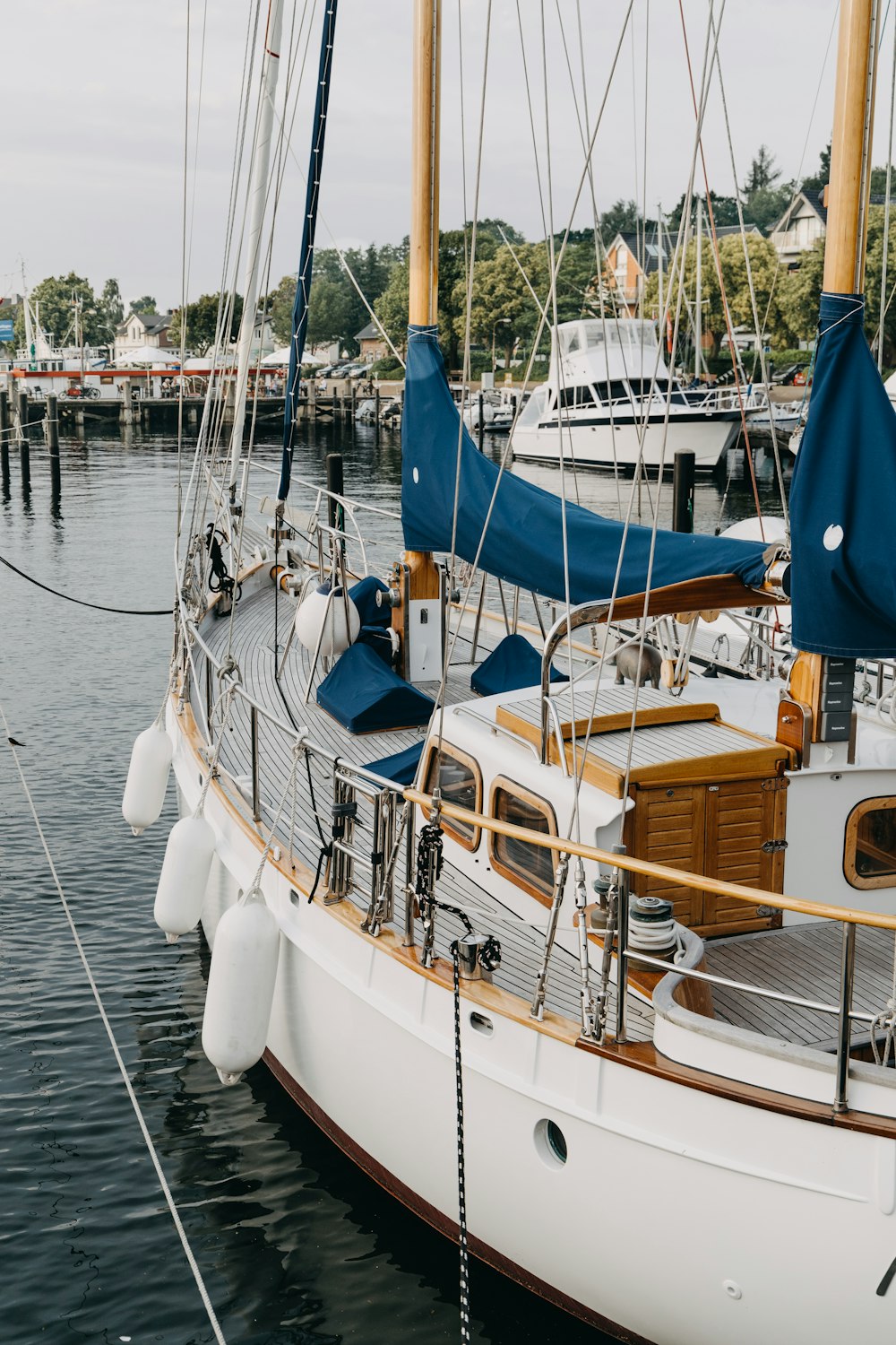 a sailboat docked at a dock in the water