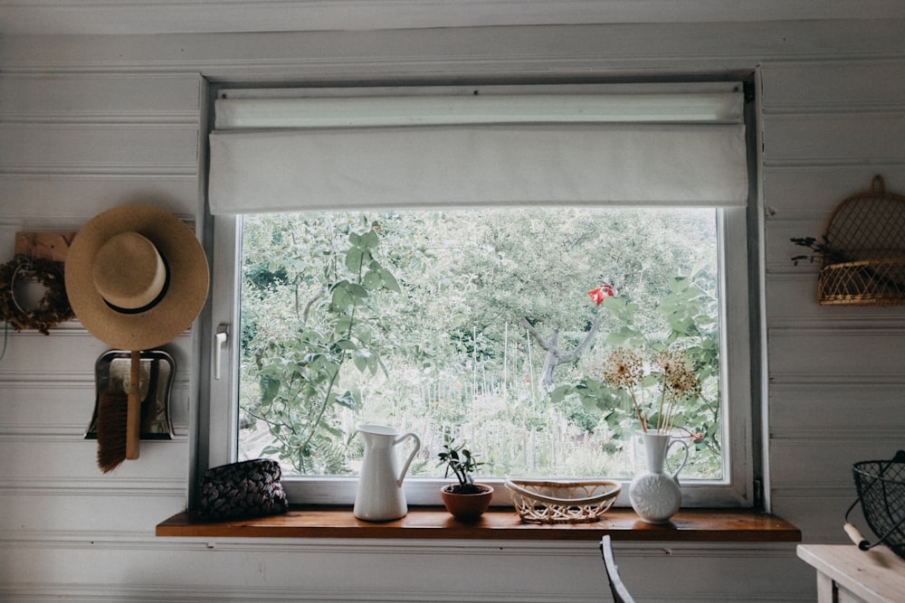 a window sill with a hat on top of it