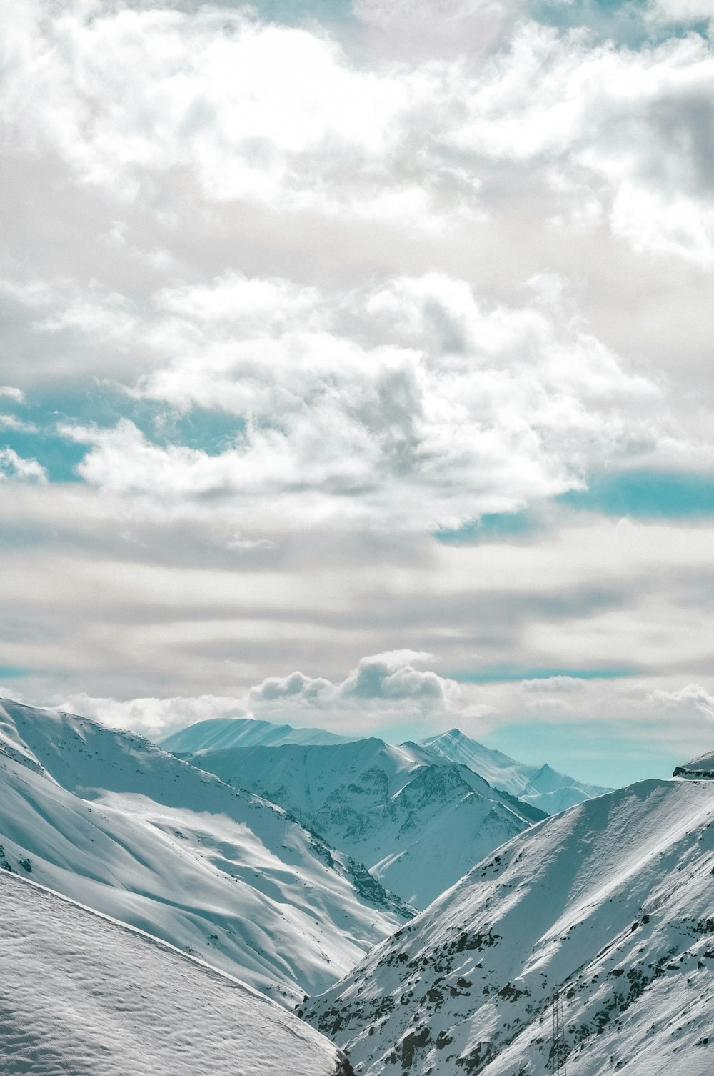 a person on a snowboard on a snowy mountain