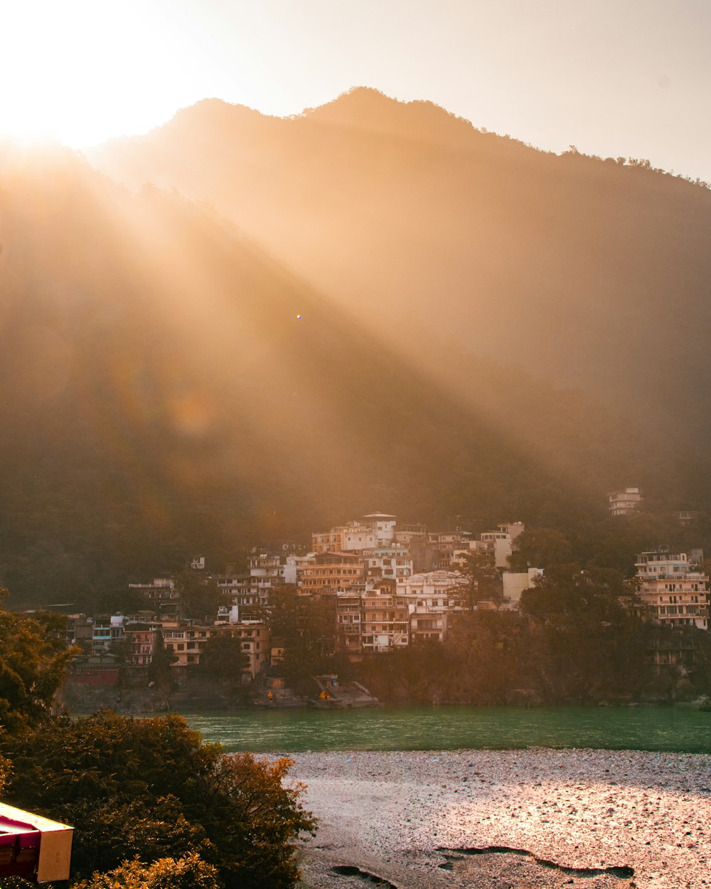 the sun shines brightly over a small town