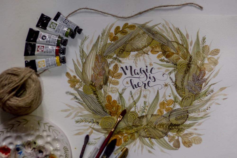 a painting of a wreath with a message written on it