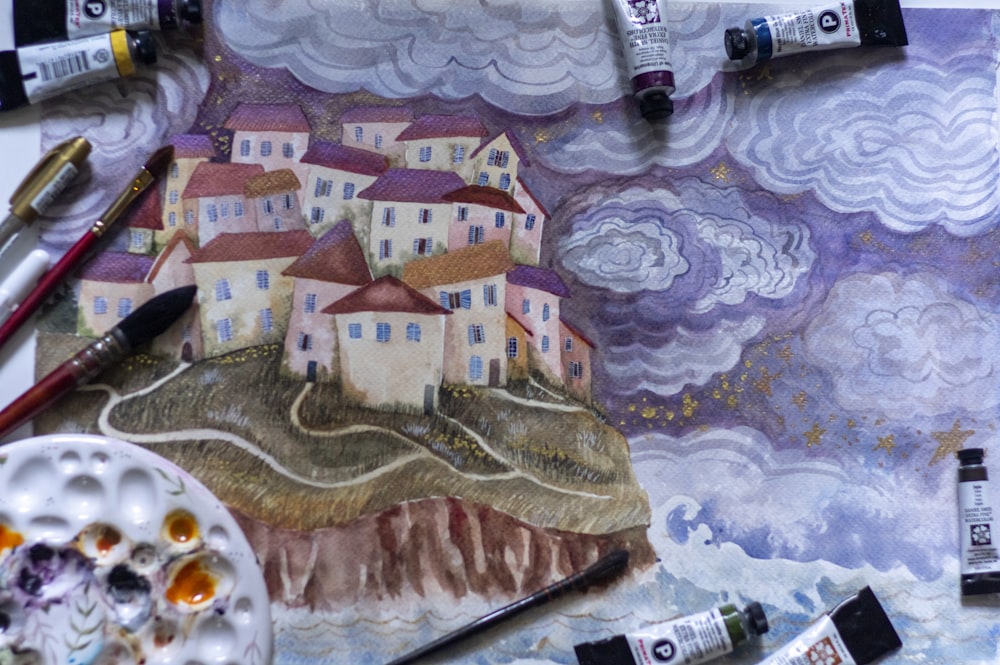 Ein Gemälde eines Dorfes auf einem Hügel