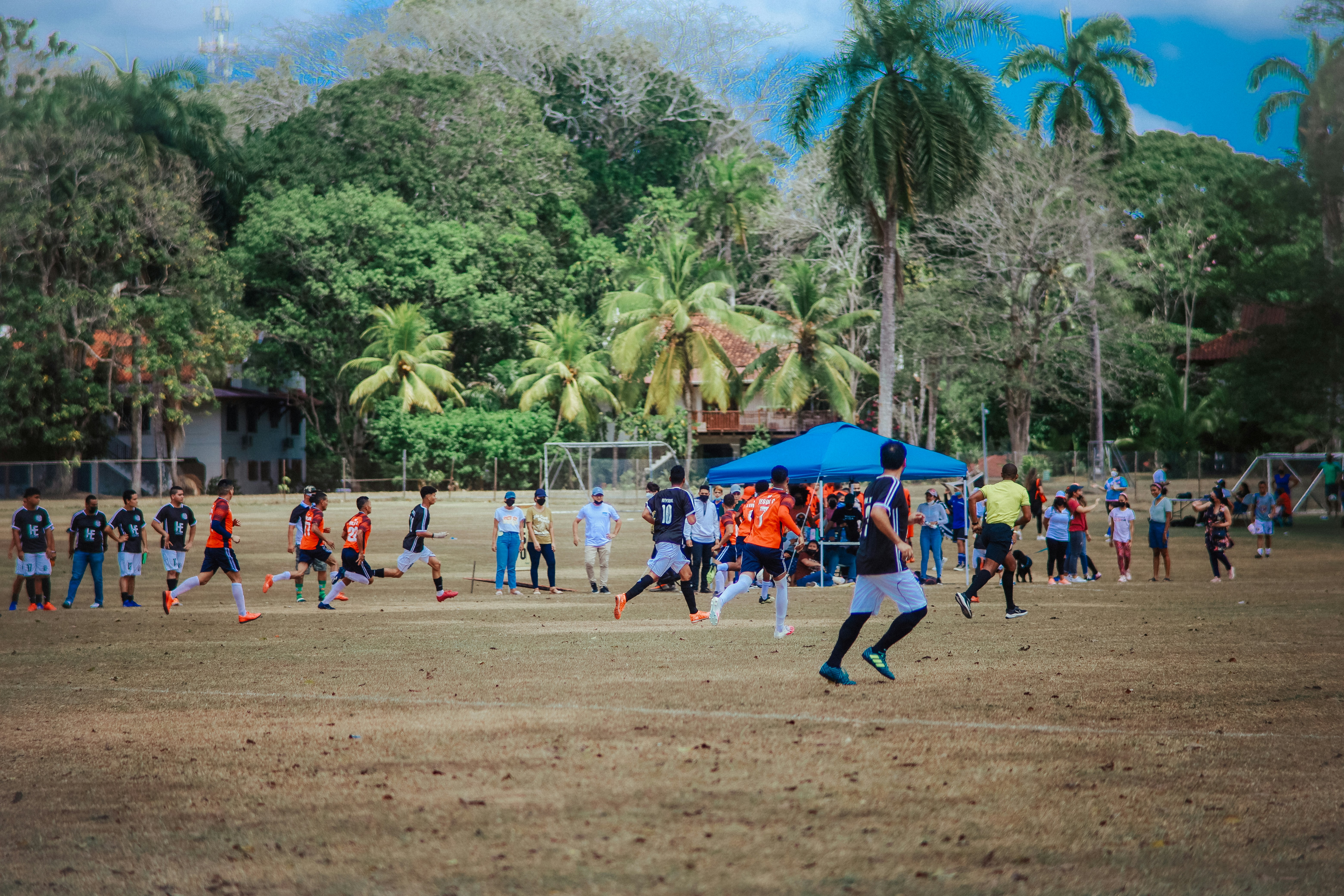 a group of people playing a game of soccer