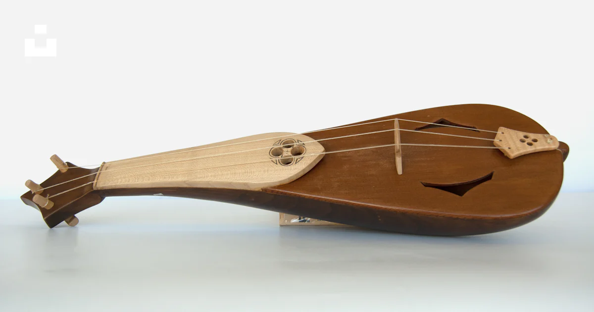 Table Like String Instrument A close up of a wooden instrument on a table photo – Free Brown Image ...
