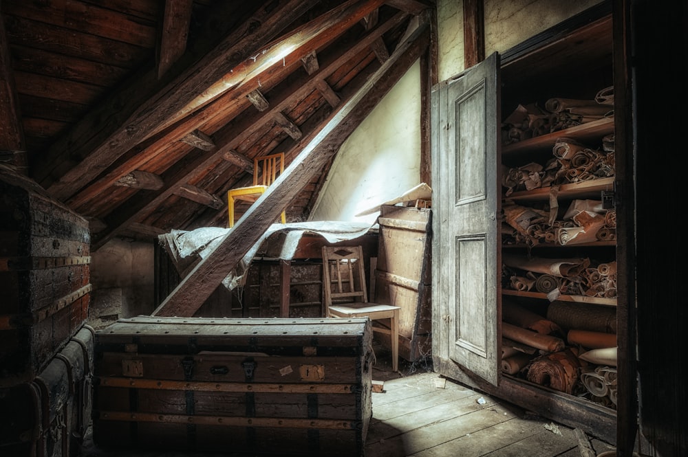 an attic with a bed and a chest of drawers