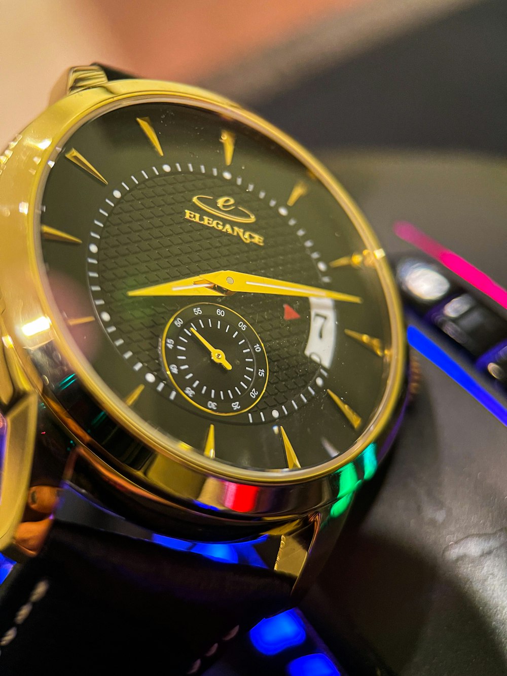 a close up of a watch on a table