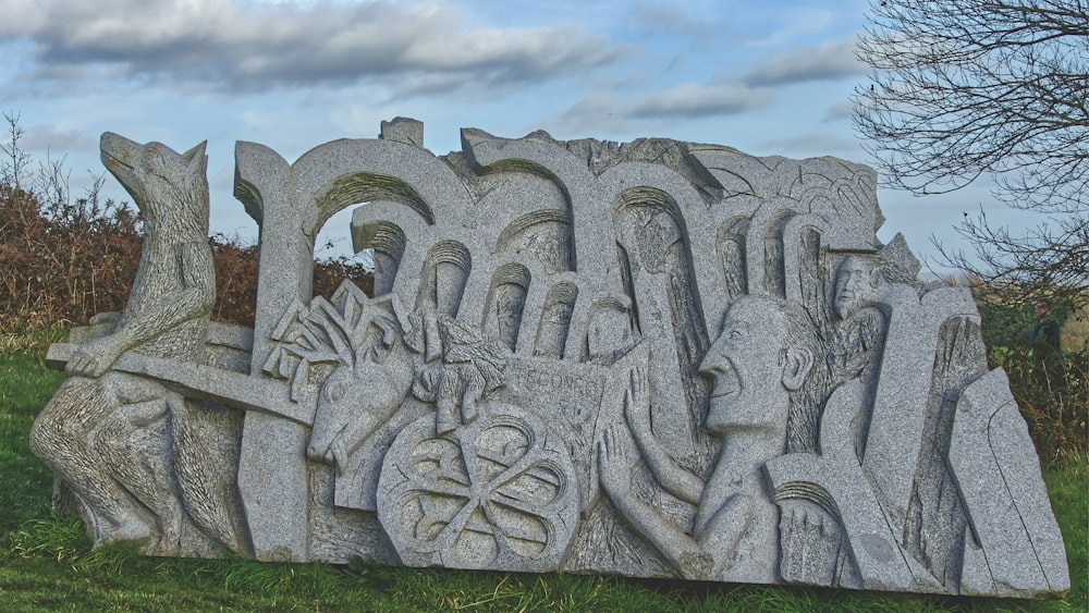 a large stone sculpture of a group of people