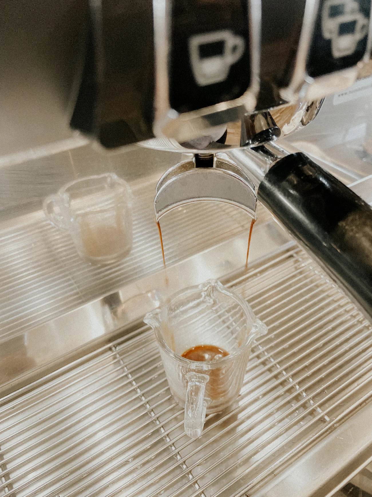 A freshly pulled cappuccino with latte art on a café counter