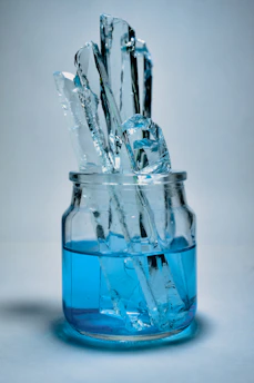 Close-up of a crystal-clear blue 20-liter water jar with fresh water inside.