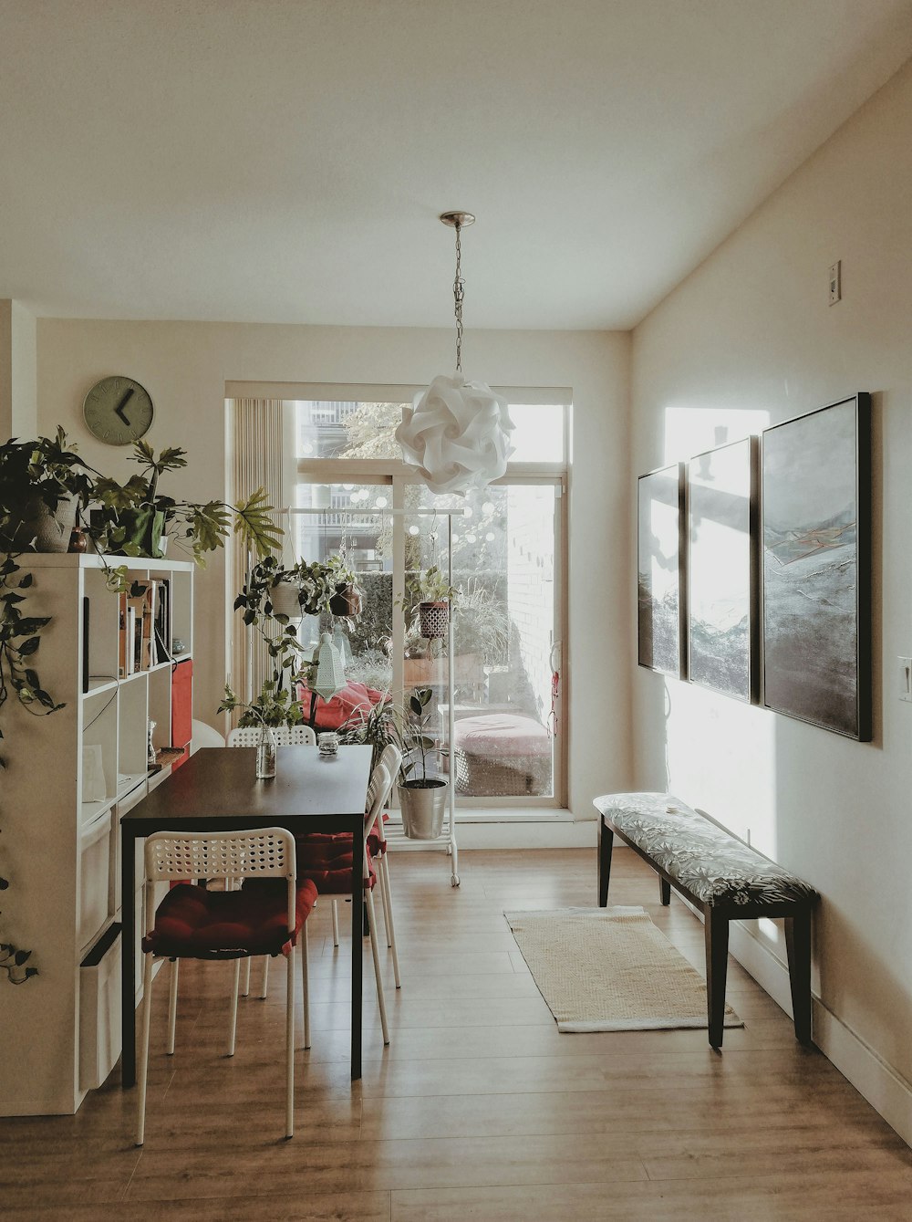 a dining room with a table and chairs