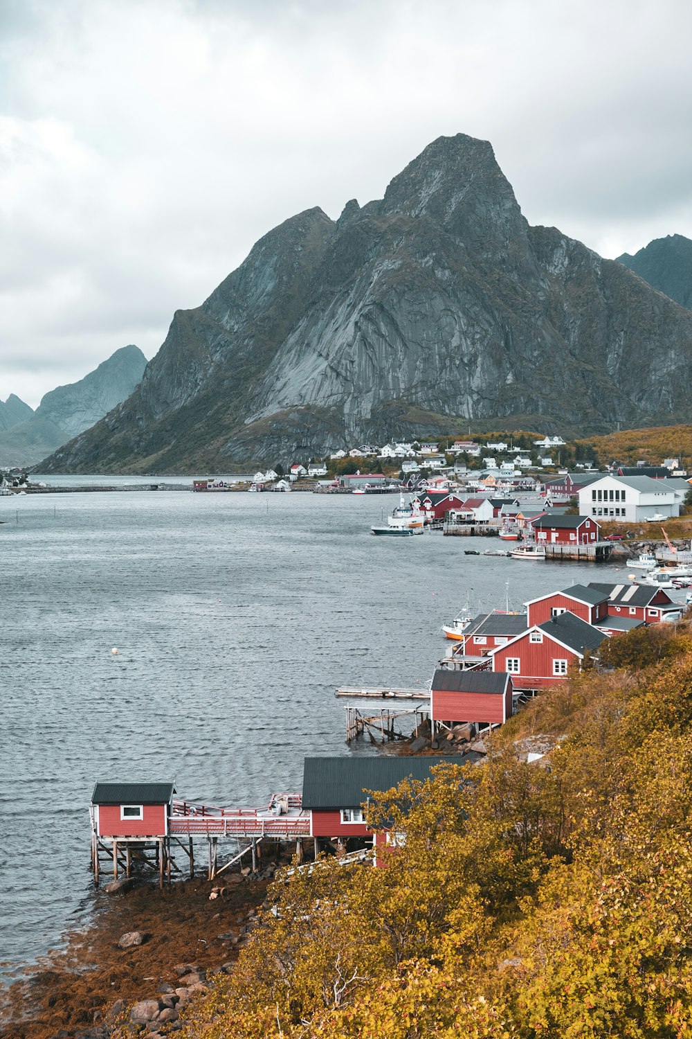 a body of water with a mountain in the background