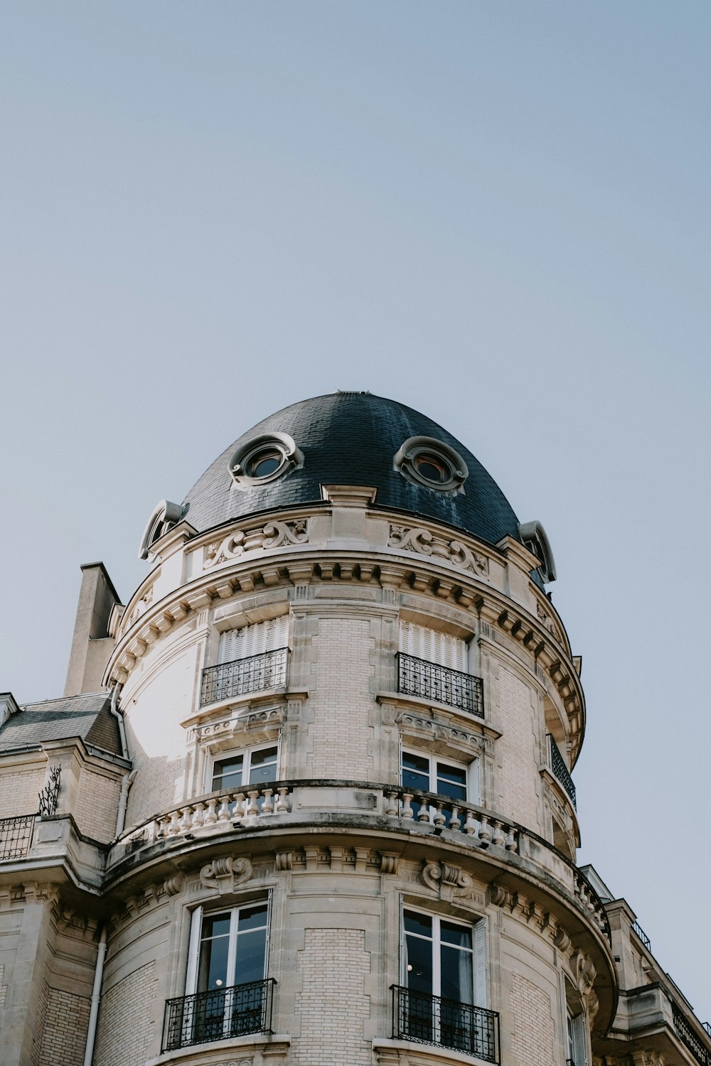 a tall building with a clock on the top of it