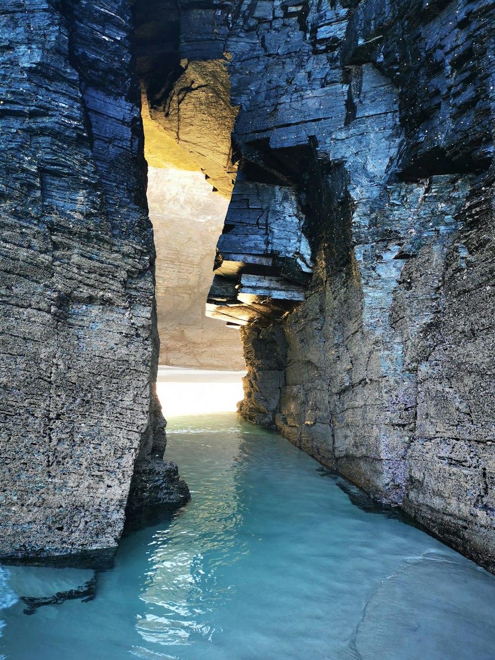 a narrow river in a canyon between two large rocks