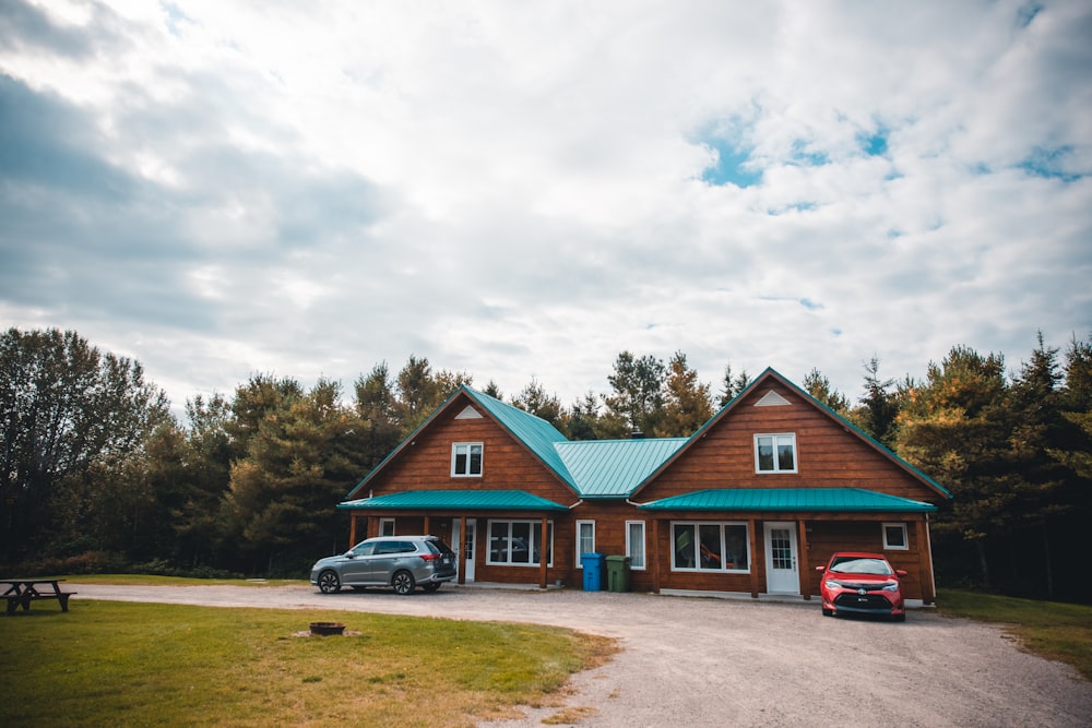 a car parked in front of a wooden cabin