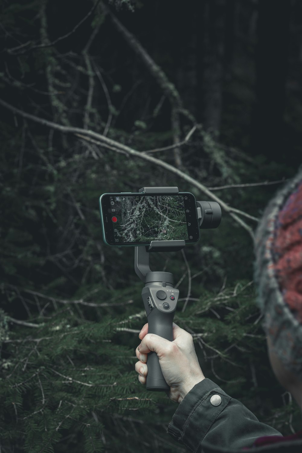 a person holding a cell phone up to a camera