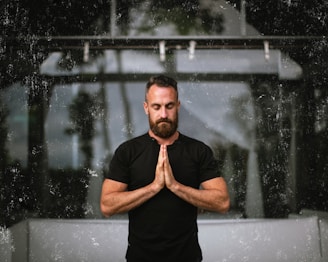 a man that is standing in the rain