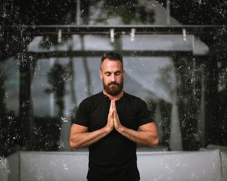 a man that is standing in the rain