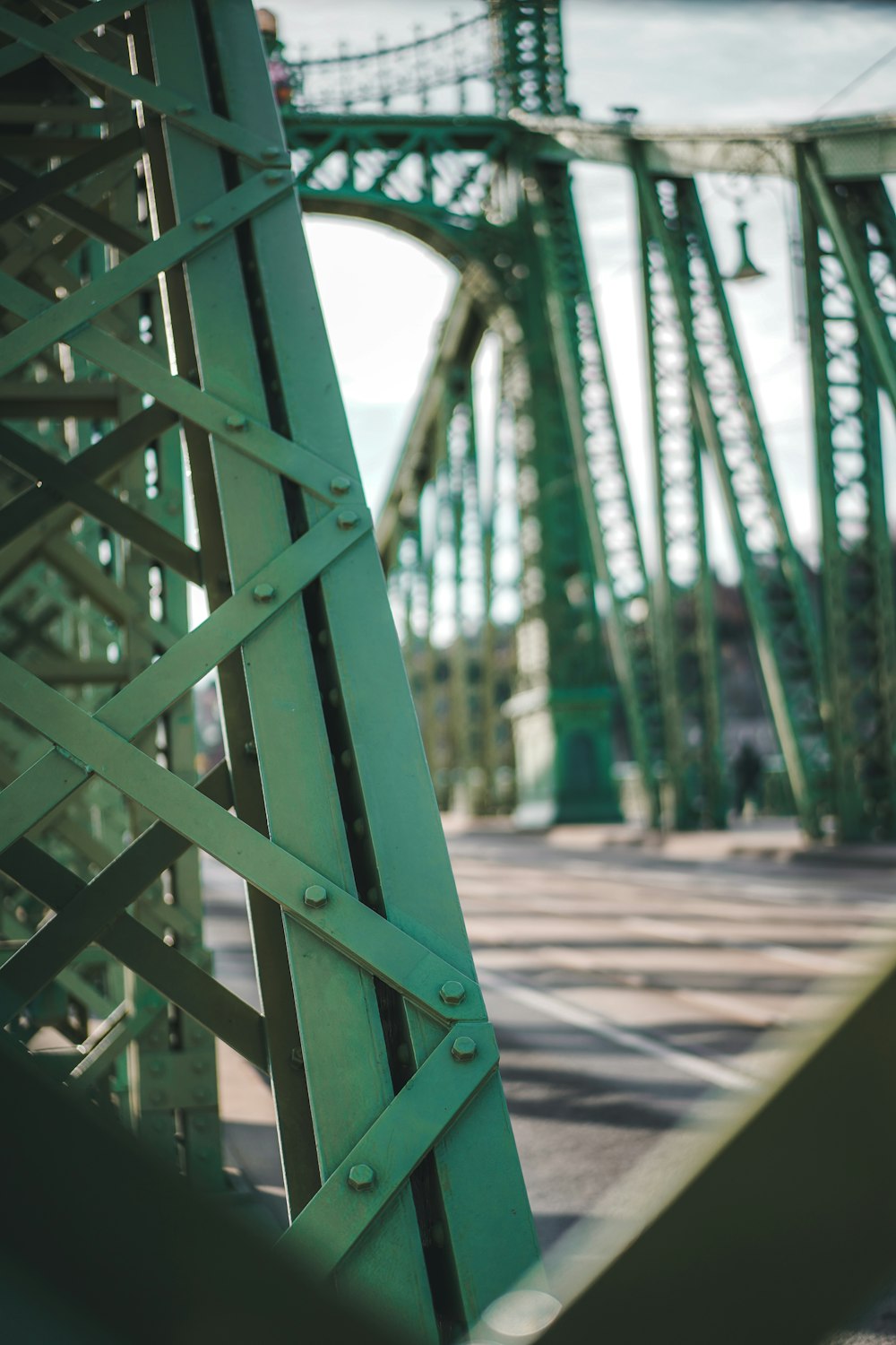 a close up of a green metal bridge