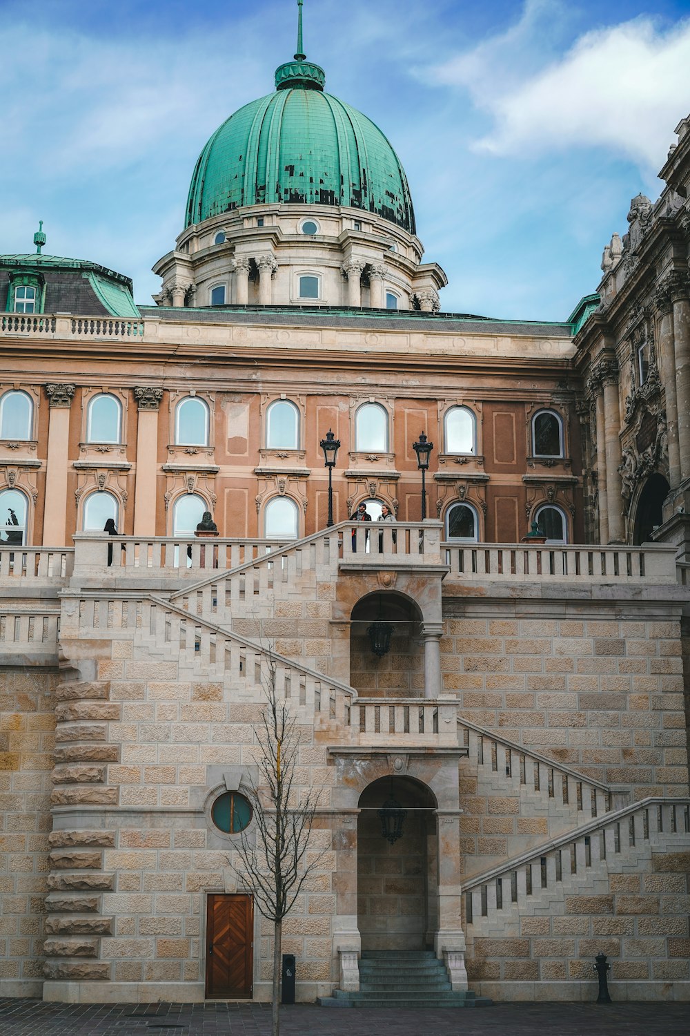 a large building with a green dome on top of it