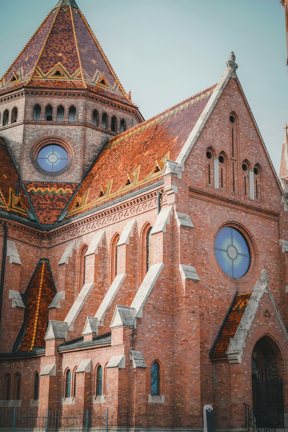 a large brick building with a clock on it's side