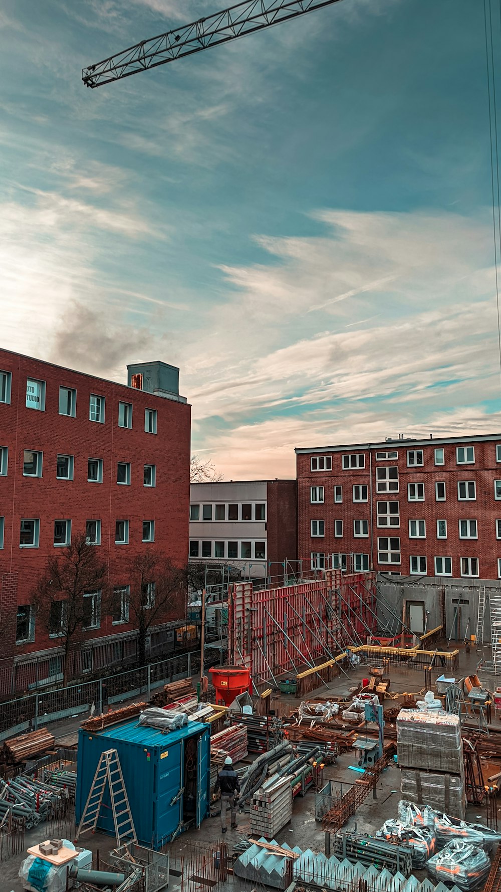 a construction site with a crane in the background