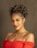 a woman in a red dress posing for a picture