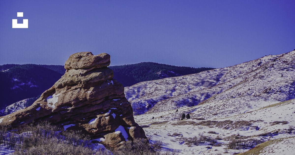 A large rock in the middle of a snowy field photo – Free South valley ...