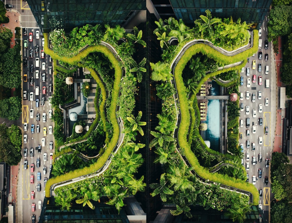 an aerial view of a city with trees and cars