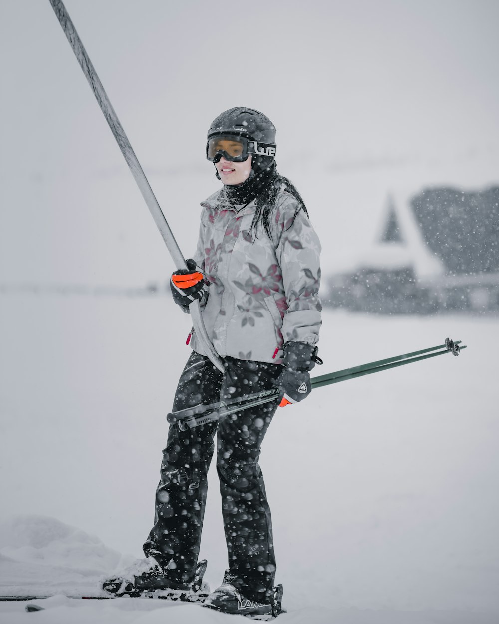 a person on skis holding a pole in the snow