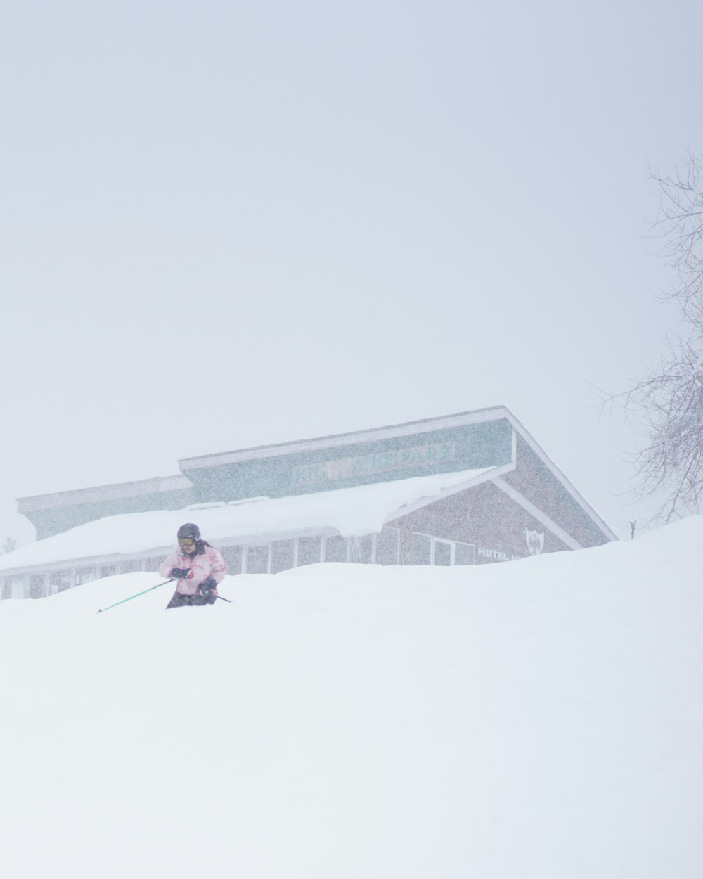 a person riding skis down a snow covered slope