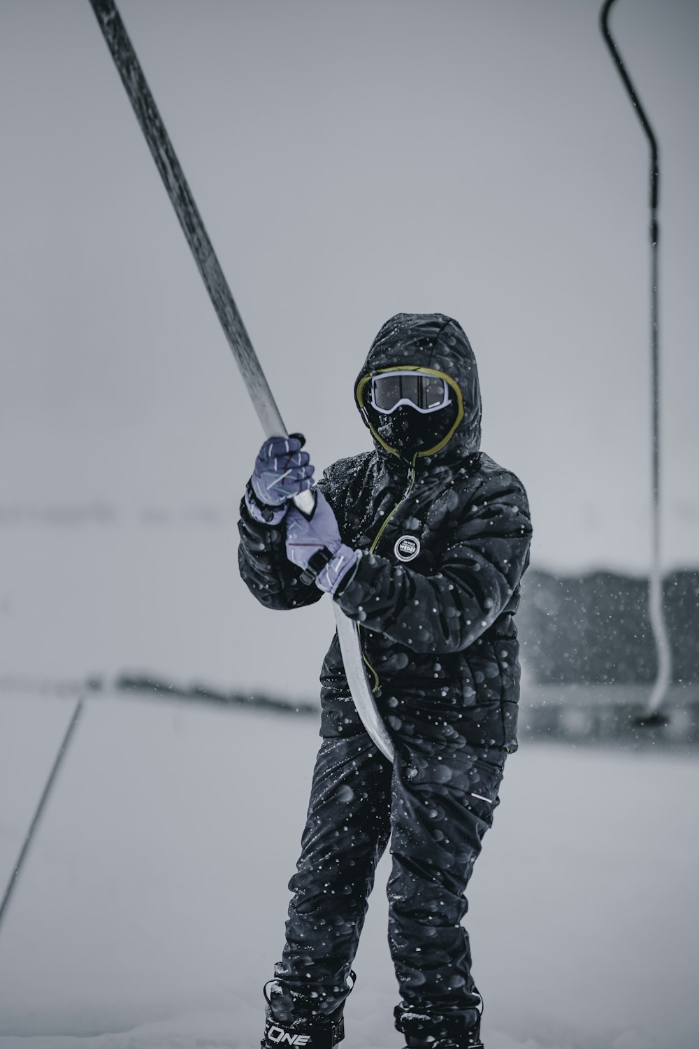 a person holding a ski pole in the snow