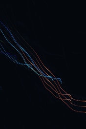 a kite is flying in the air at night